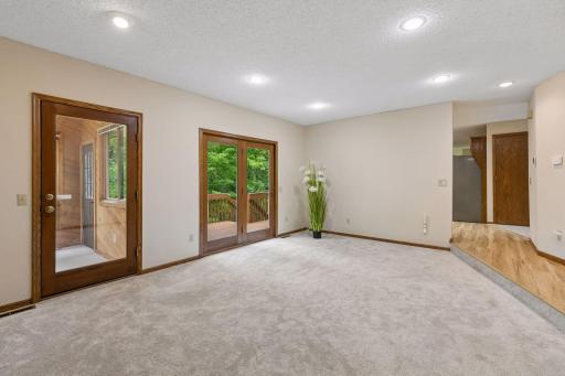 Reverse shows access to the porch & deck. Door to the right leads to the LL