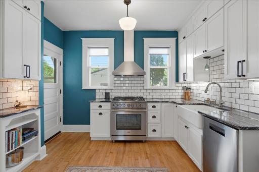 Cabinets reach the ceiling for extra storage & in keeping with the style of this era home.