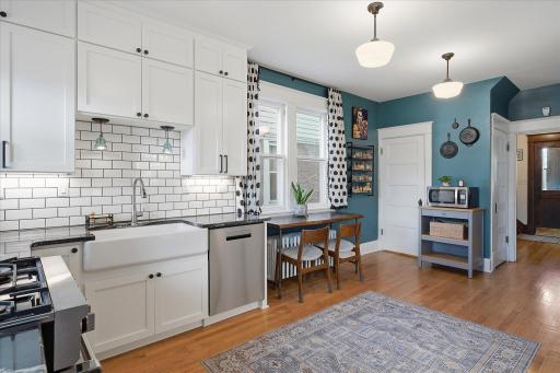 Sweet breakfast area or a spot for guests to visit while you cook! Pull out table and add a cushion for the radiator and you have an eat in kitchen area as well.