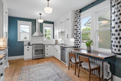 The cook will appreciate the vented hood, high end dual fuel range & large ceramic sink.