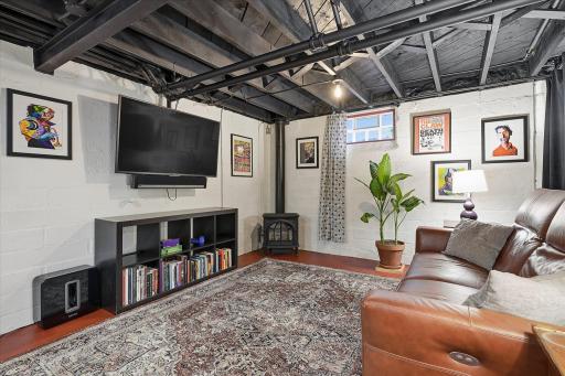 Gas burning stove w/thermostat keeps this area cozy in the winter.