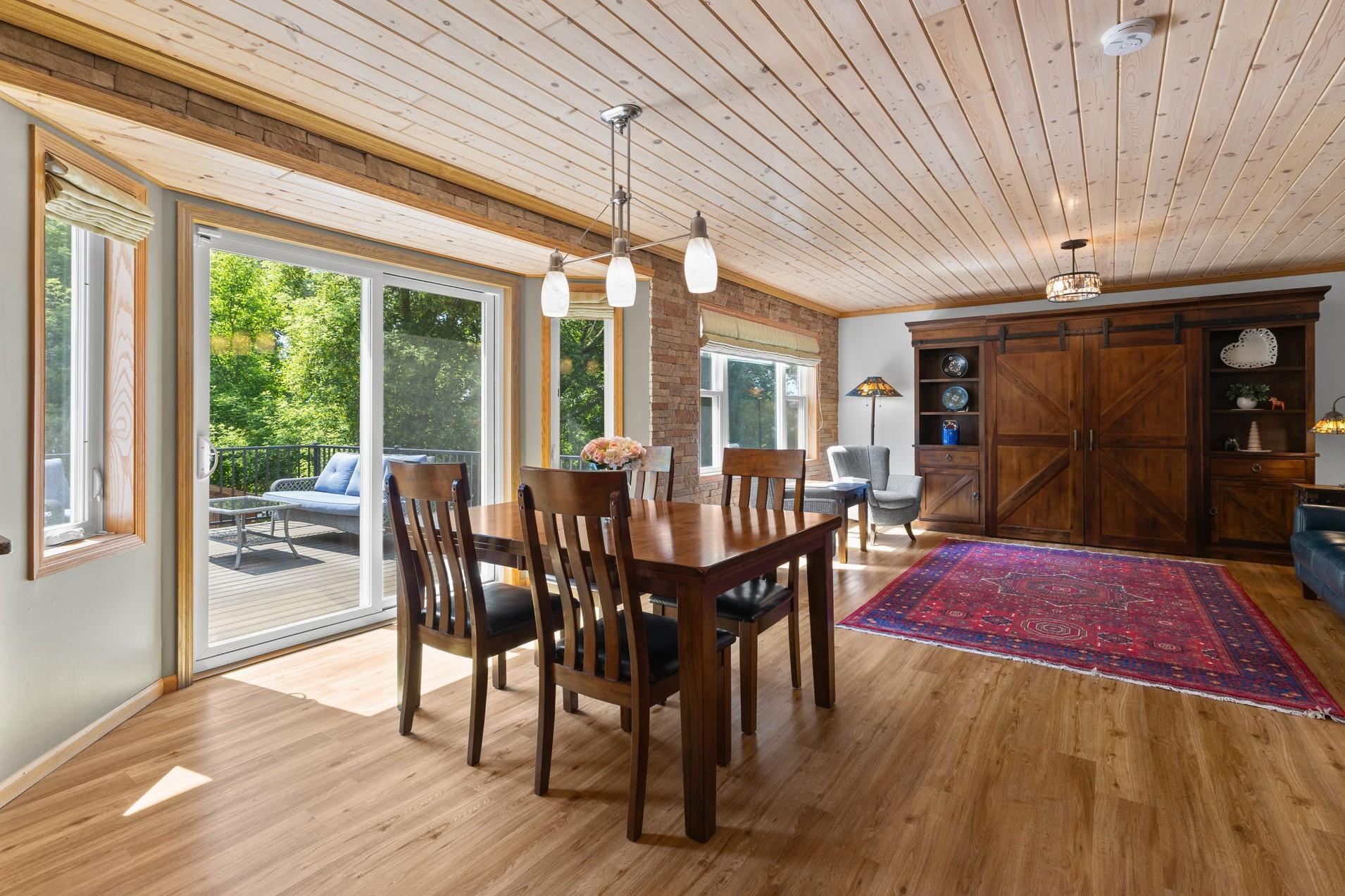 The casual dining space can accommodate a large table, and walks out the beautiful deck.