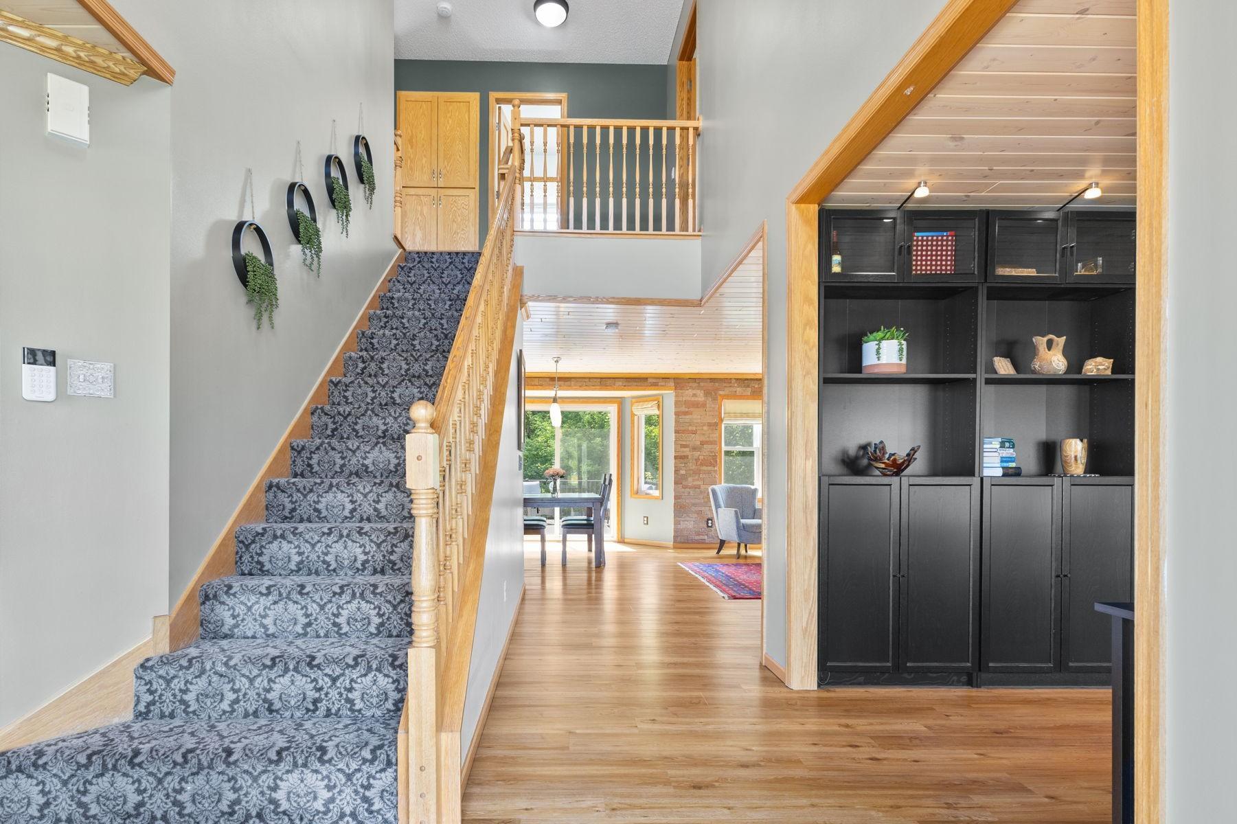 This beautiful open stairway stretches to the upstairs level.