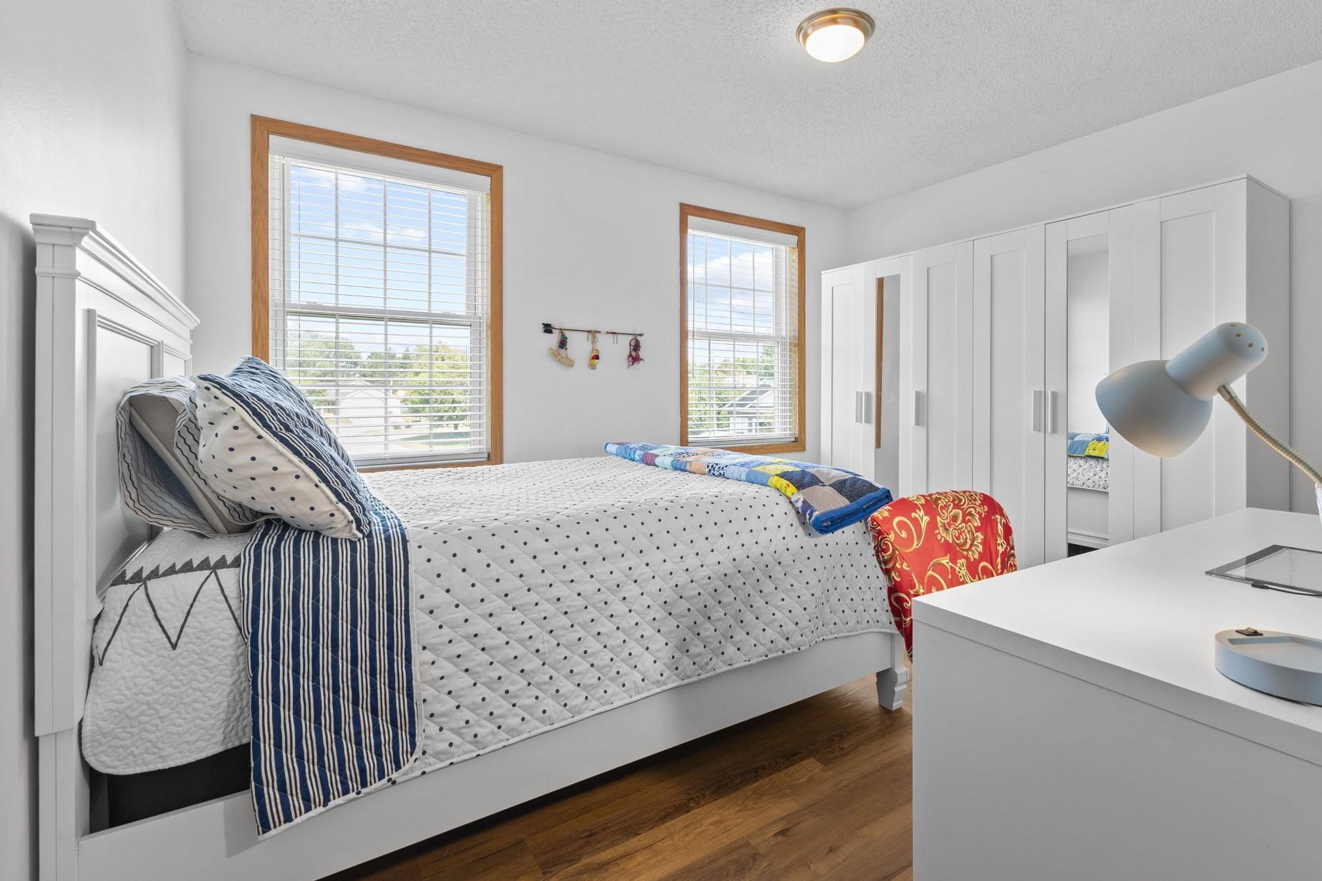 The second upstairs bedroom features two windows to let in the sun!