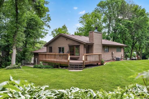 Large and freshly stained deck overlooking the private backyard