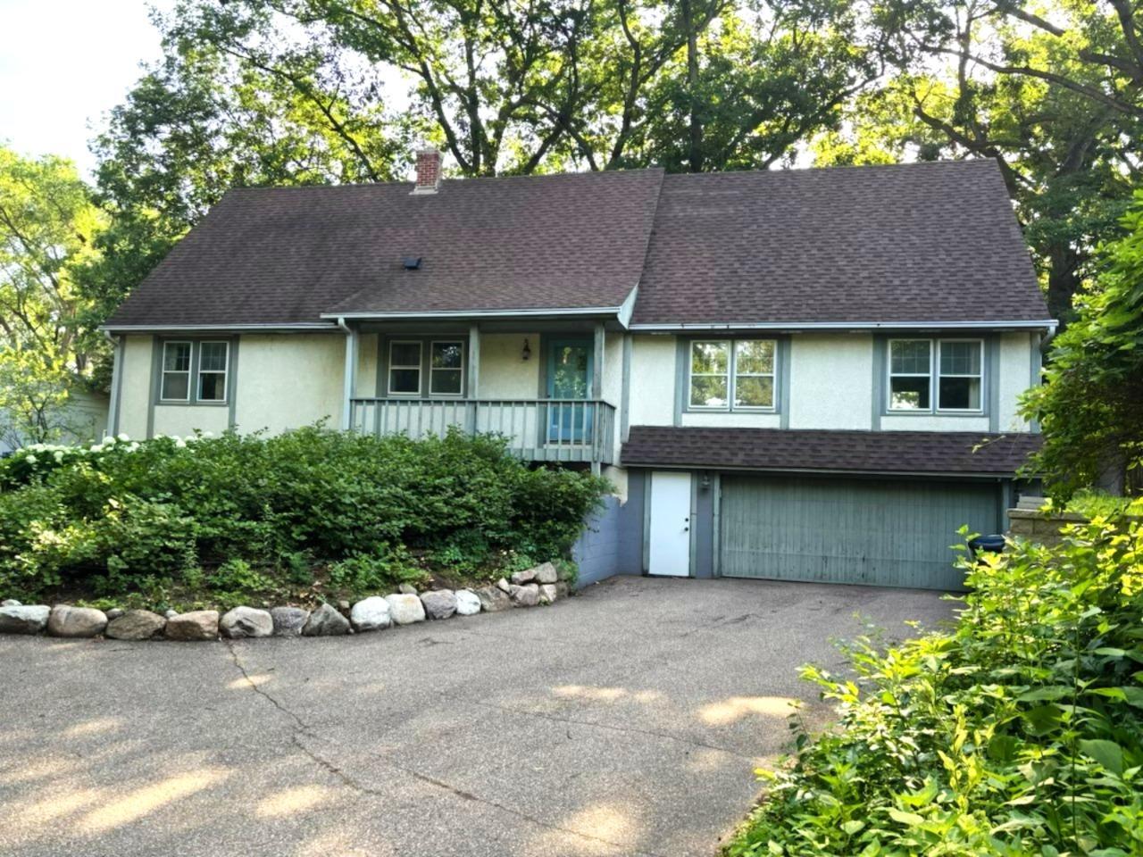 Welcome to 7017 Valley View Road - west side front with attached (tuckunder) garage, large driveway with turnaround