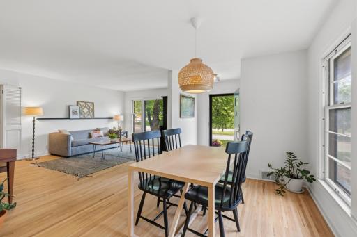 Entry features walk-in closet. Dining Area is open to the Living Room and Kitchen