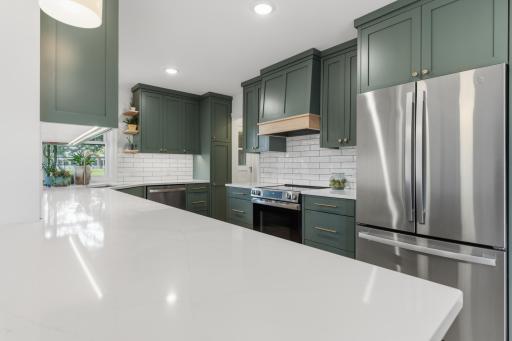 Quartz countertops and subway tile backsplash