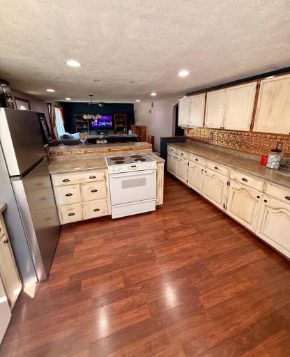 A beautiful kitchen with a perfect view of the living room and dining room.