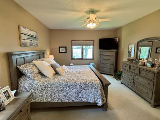 29-Primary bedroom suite with lake views.jpg