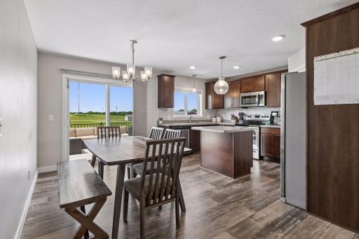 Dining & Kitchen Areas w/ Access to Maintenance-Free Deck