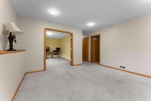 Additional view of bedroom with double doors and the other secondary bedroom on lower level.