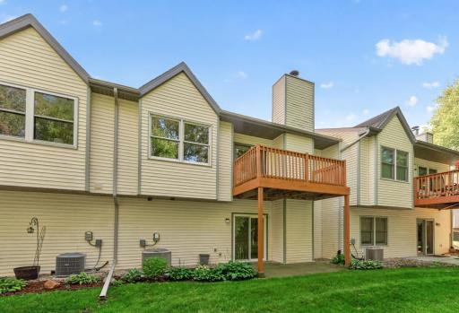 Rear exterior with upper-level deck and lower-level walkout.