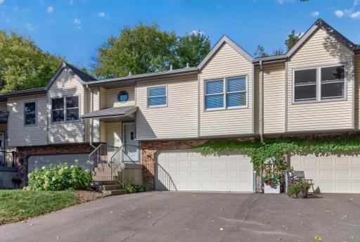 Spacious driveway with an attached 2 car garage.