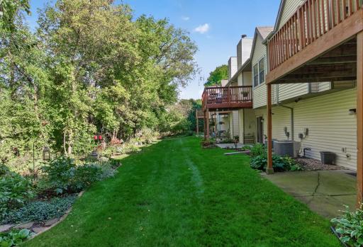 Beautiful green space surrounded by mature trees.