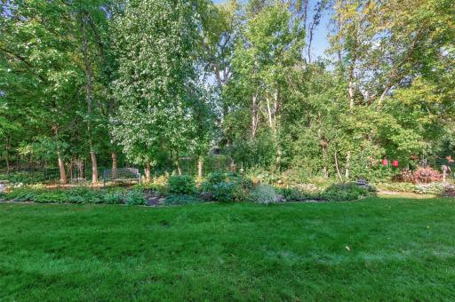 Enjoy the wooded backdrop and pretty landscaping.