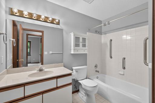 Dual-access upper-level full bath connecting the primary bedroom and hallway.