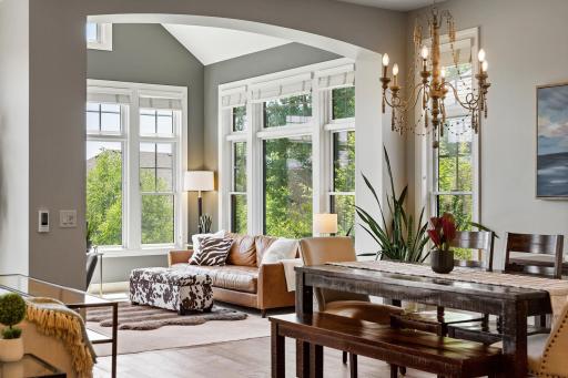The vaulted sunroom provides a peaceful retreat and opens directly to the deck.