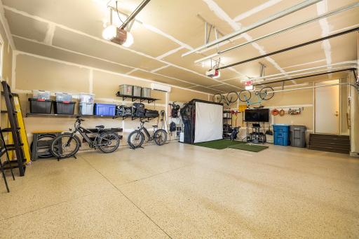 Rare, fully finished, insulated three-car garage, complete with dedicated heating and cooling and built-in EV charging infrastructure.