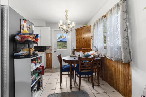 The informal dining area offers a cozy place for meals with easy access to the deck.
