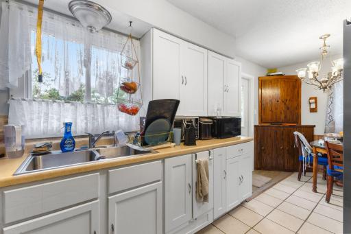 Crisp white cabinetry with plenty of storage and prep space.