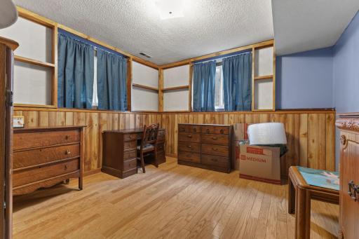 This lower-level bedroom could also serve as a home office, hobby room or creative workspace.