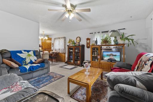 The living room flows easily into the dining area and kitchen.