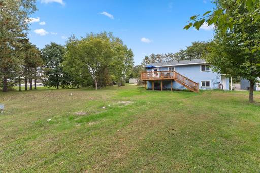 The expansive yard offers plenty of room for outdoor activities, gardening and recreation.