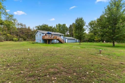 Surrounded by mature trees and open lawn, the property offers a peaceful rural atmosphere.