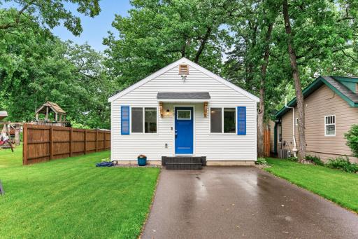 Thoughtful additions - paved driveway and blue shutters and front door