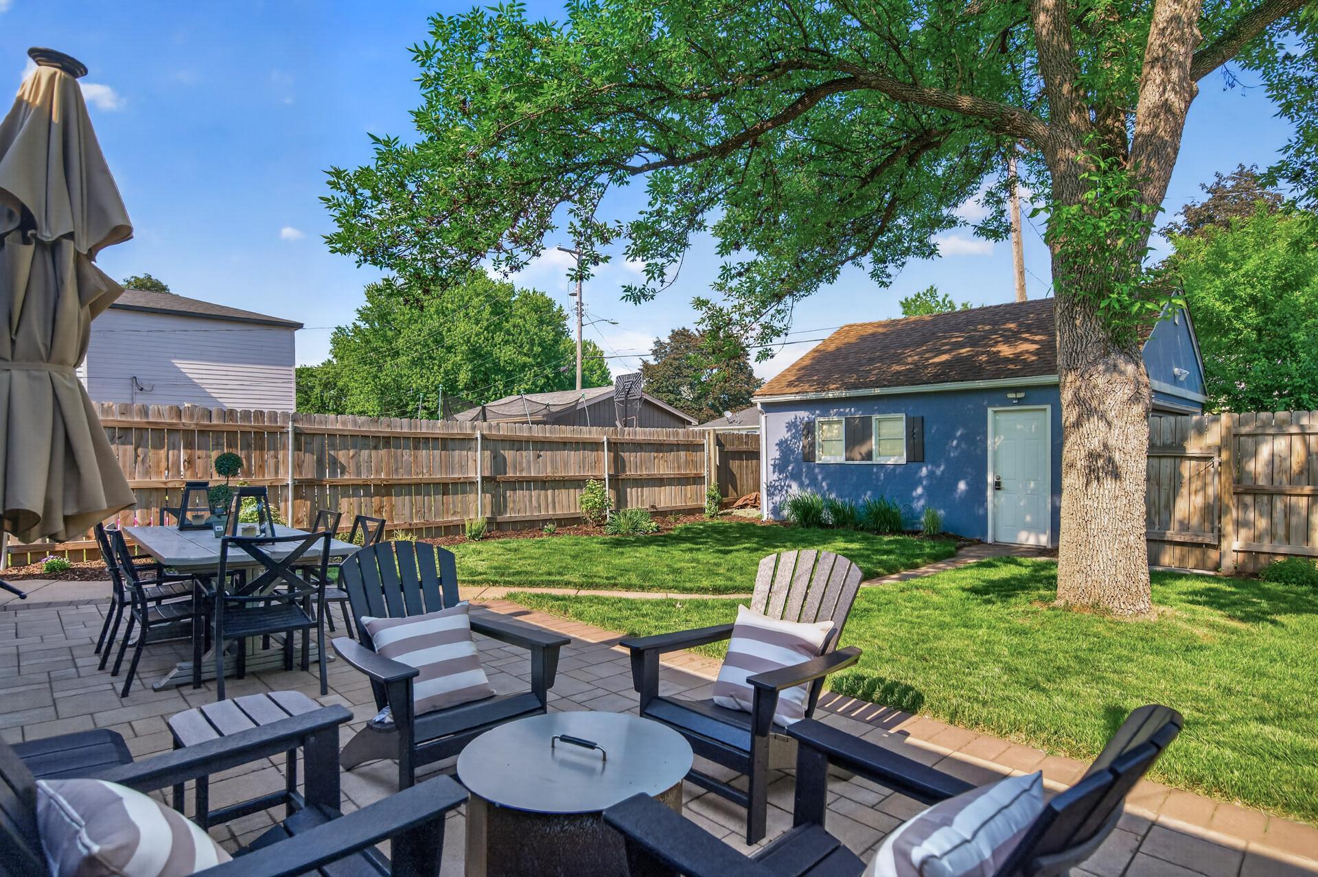 Idyllic Backyard setting includes new Paver Patio, Privacy Fence, and Garden. Perfect for entertaining guests or unwinding after a long day of work.