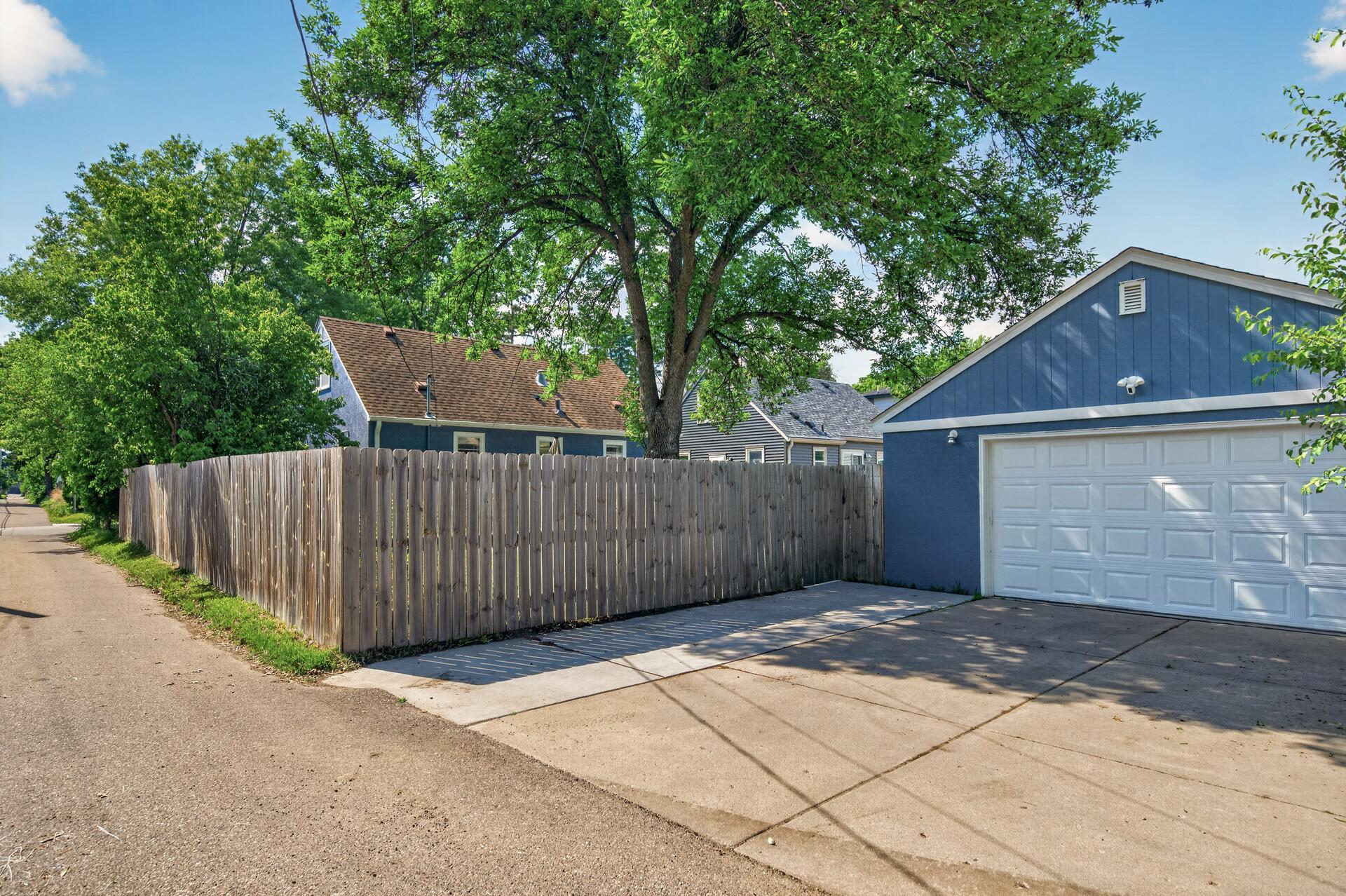 Heated and Insulated Two Car Garage features a recently re-poured concrete slab and LED lighting. Driveway includes an additional parking space perfect for a third car or guests
