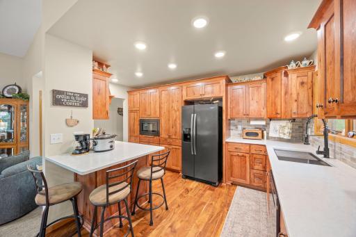 Newly remodeled in 2025 kitchen with custom cabinets, quartz countertop and under mount sink