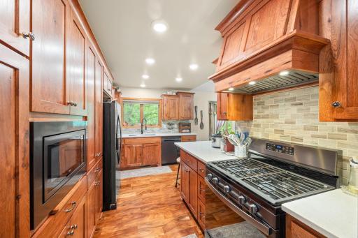 Newly remodeled in 2025 kitchen with custom cabinets, quartz countertop and under mount sink