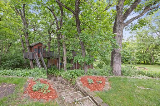 Incredible tree house with suspended bridge!