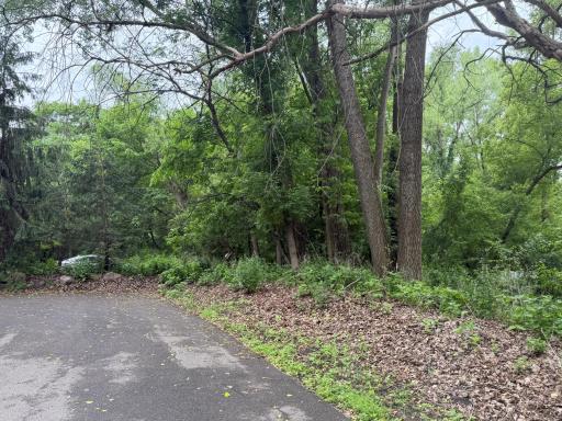 This end unit offers plenty of privacy, with mature trees and ample parking.
