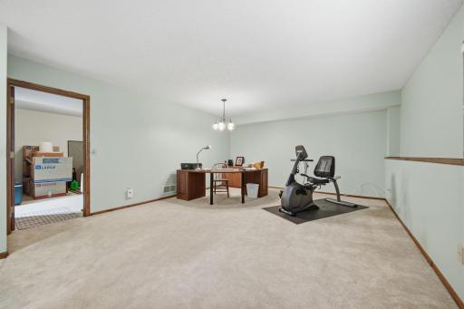The lower level offers ample space for an additional bedroom or workout room, along with a large adjoining room that is already plumbed for a full bath.