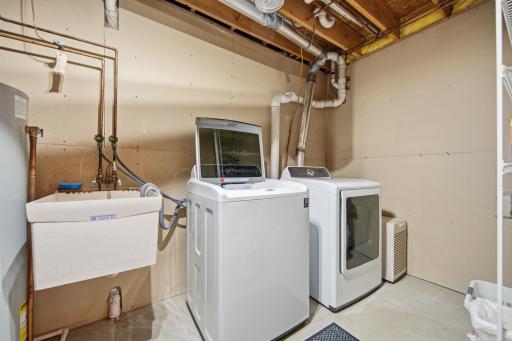 The home features a newer washer and dryer, a new water heater installed in 2023, a new furnace in 2020, new A/C in 2026, and a roof replaced in 2021.