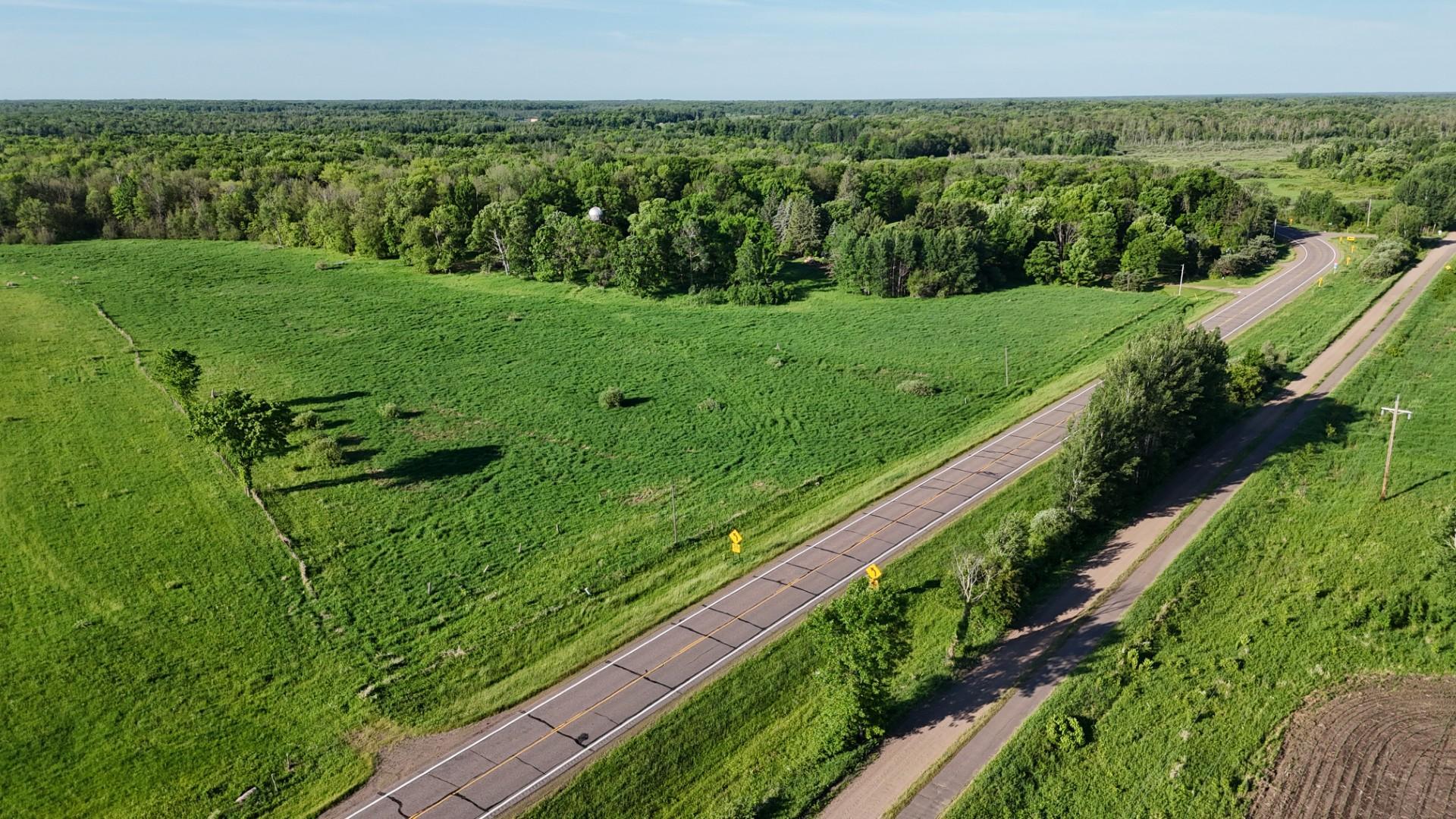 Located on a paved road! Easy access. That isa the Soo Line Trail system on the right side.