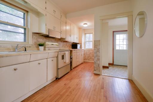 The main level features a walk-through kitchen