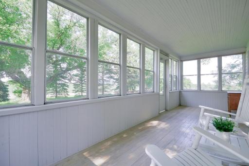 A covered rear porch and deck provide additional space to relax and enjoy the acreage