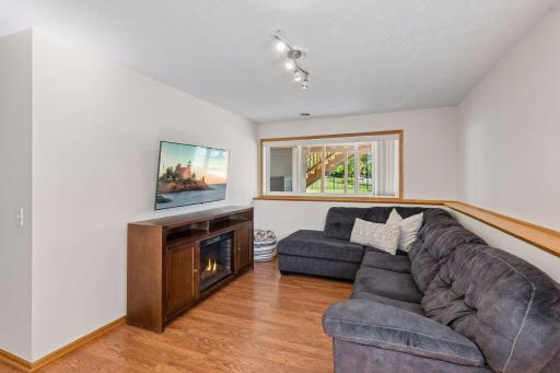 The lower-level family room provides a cozy retreat while expanding the home's living space.