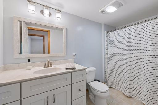 A full lower-level bath adds convenience for guests and everyday living.