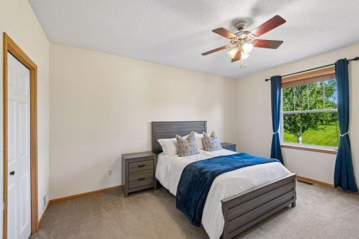 Inviting primary bedroom with walk-in closet.