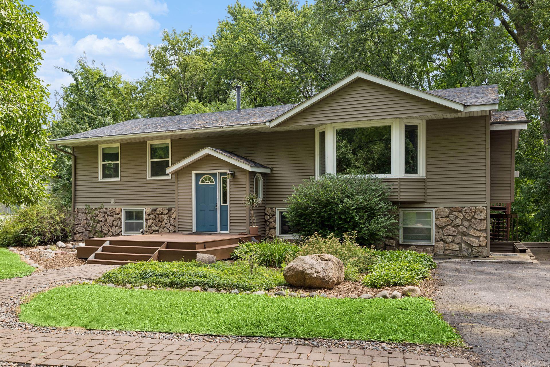 Fantastic curb appeal highlights this home, featuring mature landscaping, and an attractive stone-accented facade!