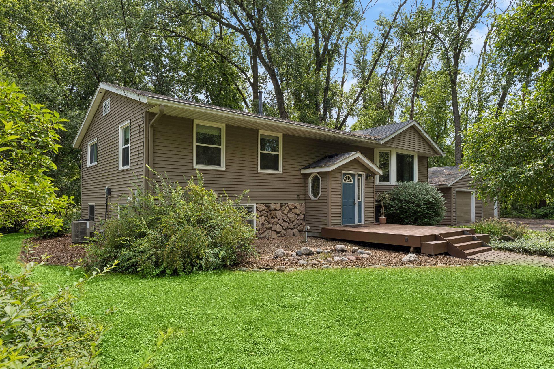 Charming 4BR/2BA Arden Hills home on a private wooded lot. Features a bright layout and entry patio!