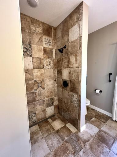 primary suite bath tile shower.jpg