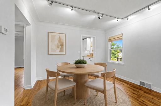Virtually staged dining room showcasing the spaceâs potential