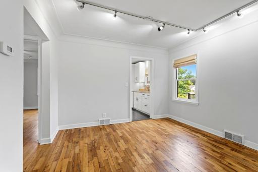 Dining room with beautiful flooring and abundant natural light