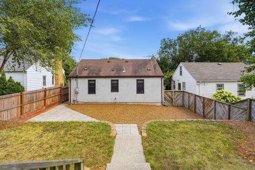 Spacious, fully fenced backyard with patio space